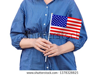 United States flag. Close up of woman's hands holding a national flag of USA isolated on white background.