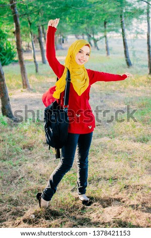 A young female muslim student with hijab