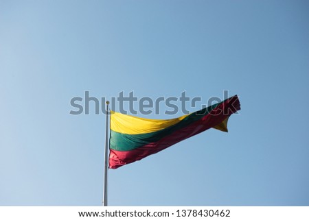Lithuanian Flag Waving With Wind On Blue Sky