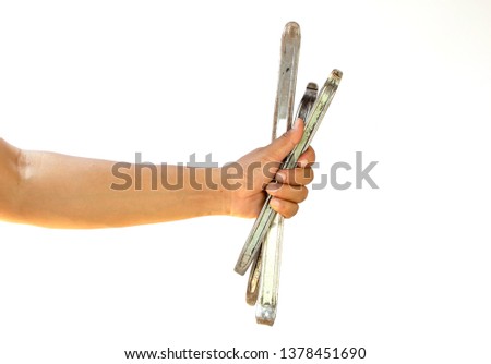 hand holding tire lever isolated on white background