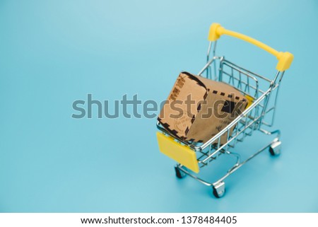 Many paper box  in shopping cart.