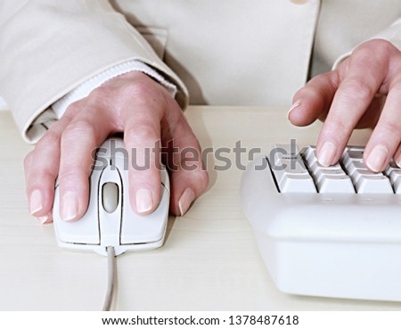 woman in an office with keyboard and mouse on white background stock image and stock photo