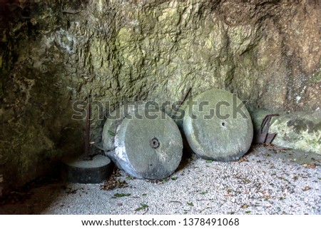 Stone Wheels in a Cave At a Park at Villa D'Ayala Valva, Italy