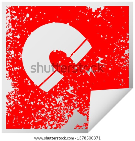 distressed square peeling sticker symbol of a magnet
