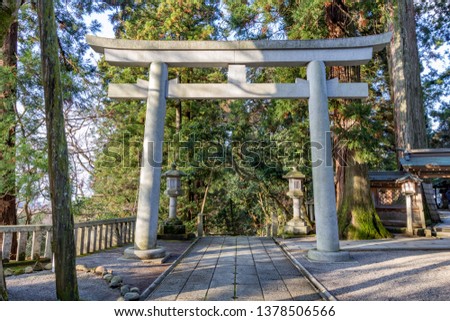 Torii gate at Shirayama Hime Shrine, Ishikawa Prefecture, Weatern Japan. A torii symbolically marks the separation between the profane world to the sacred world.