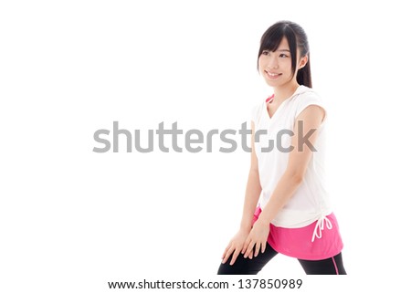a sporty young asian woman exercising on white background