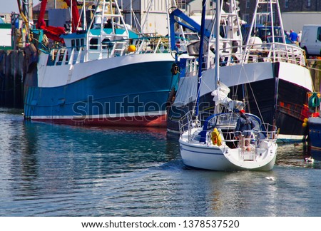  Boats at Amble Harbour in Northumberland on the coast of North East coast of England, Royalty-Free Stock Photo #1378537520