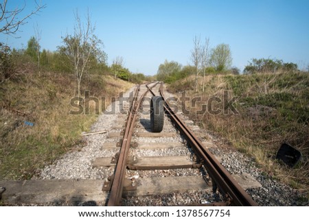 Rubber truck tyre on a railroad track
