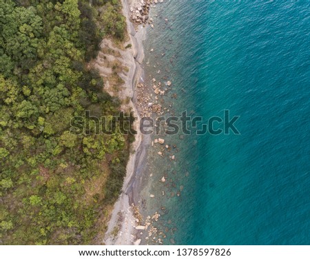 Cliffs and blue sea coast shot from above