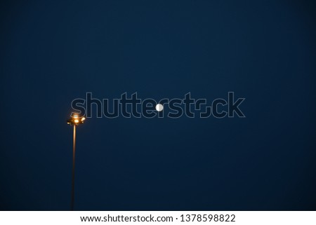 Dark sky with lamp and moon