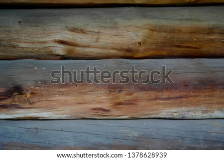 Texture background, old wooden boards. Semicircular logs, hut.