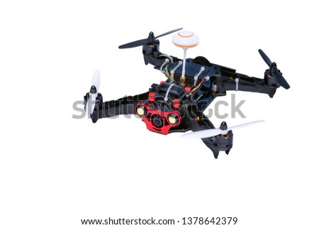 Sport copter. Dron, quad copter Isolated on white background. Remote controlled dron, quadro copter with digital camera. Closeup. New tool for aerial photo and video. Royalty-Free Stock Photo #1378642379