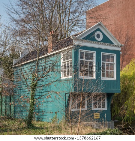 Dutch old classic wooden house in Zaandam ('aanleg verboden' means that you can't moor your boat there)