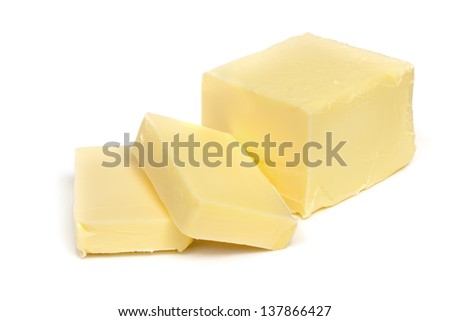 Stick of butter, cut, isolated on white. Royalty-Free Stock Photo #137866427