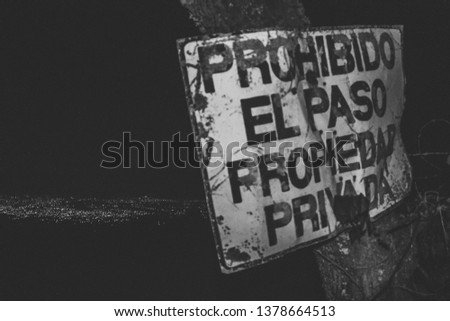Dont trespass sign with night city background