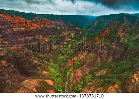 An aerial helicopter view of the power of erosion in Waimea Canyon State Park, also called the "grand canyon of the pacific" on the west side of the island of Kauai, Hawaii, United States.