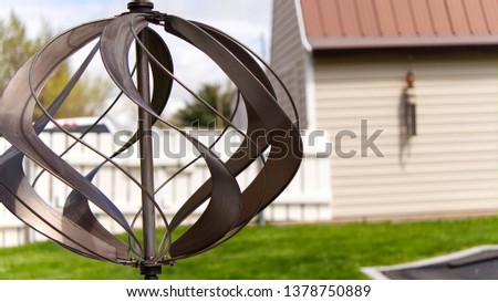 a spinning wind mill with blurred background