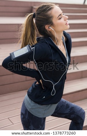 Young woman runner resting after workout session at outdoor