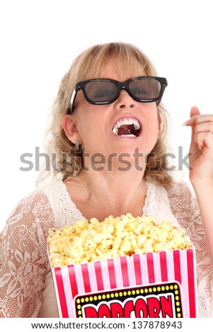 Im having so much fun! Woman with a popcorn bucket and 3-d glasses. White background.