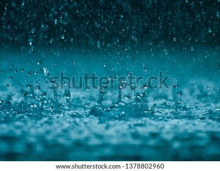 Rain water drop falling to the floor in heavy rain day