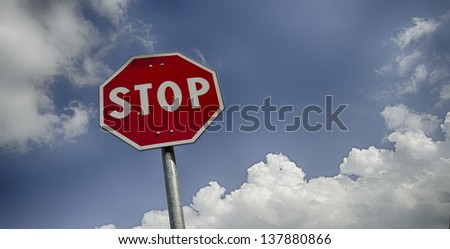 Stop road sign with clouds and free space for text