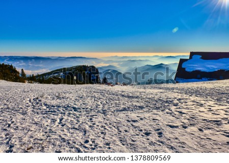 Amazing Landscape view from Ceahlău Mountains witn Sea of clouds in winter season, Aerial winter Landscape in National Park