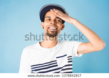 african american guy dressed in sailor uniform on blue background