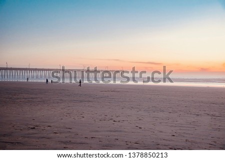 sunset on the pier of Pismo Beach in California
