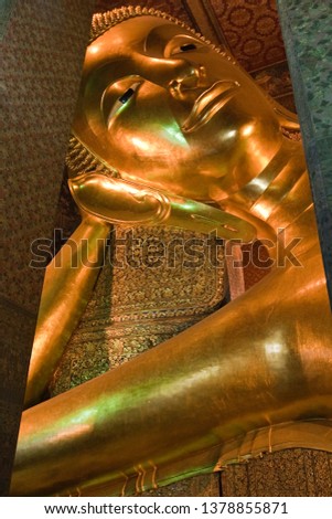 Reclining Buddha or Wat Pho (Pho Temple) in uprisen angle with 6M long & 15M high as the longest recling Buddha in one of the oldest temples in Thailand, Asia.