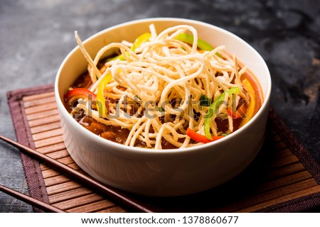 American chop suey/ chopsuey is a popular indochinese food. served in a bowl with chop sticks. selective focus