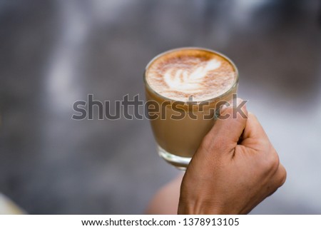coffee latte art espresso in coffee shop vintage color tone,soft focus,noise, film grain, Selective focus.