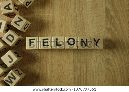Felony word from wooden blocks on desk Royalty-Free Stock Photo #1378997561