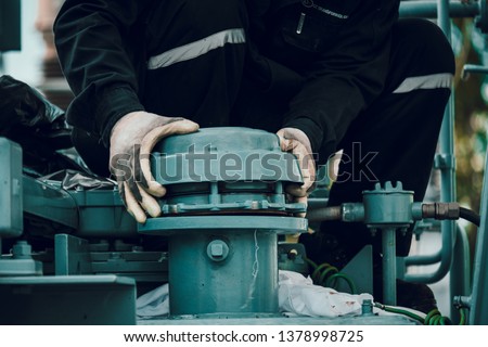 technician hookup pressure relief valve of high voltage transformer Royalty-Free Stock Photo #1378998725