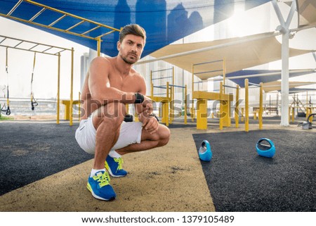 Young athletic man training outdoors - Young adult doing a fitness workout