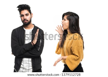 Indian young couple quarreling on white background