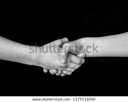 children's handshake, black and white photo