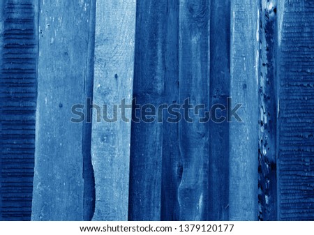 Old grungy wooden planks background in navy blue tone. Abstract background and texture for design.