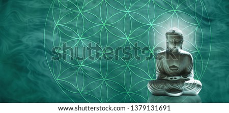 Jade Buddha meditating on the Flower of Life - Lotus position buddha on right with a jade hue against a wide jade gaseous  background and the Flower of Life symbol
