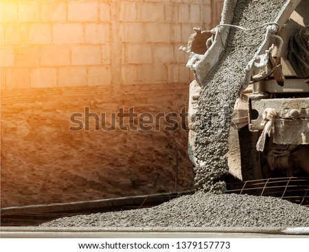 Pouring ready-mixed concrete after placing steel reinforcement Royalty-Free Stock Photo #1379157773