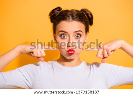 Close up photo of young attractive hipster student making faces cheering up wearing white sweater isolated on colorful background