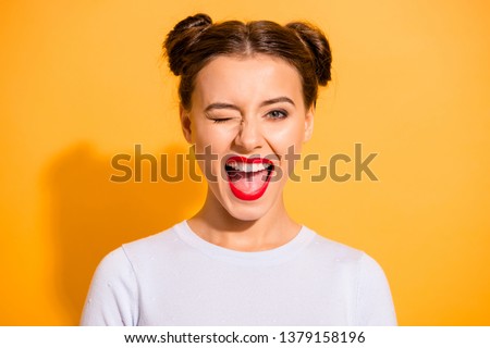 Close up portrait of lovely cute funny lady making winks opening her mouth shouting yeah having holidays dressed in white comfortable clothing isolated on bright background Royalty-Free Stock Photo #1379158196