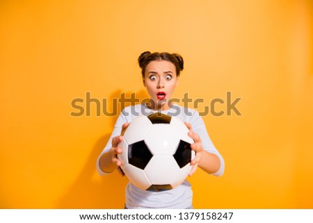 Close up photo amazed beautiful hairdo she her lady hold raise hands arms round leather ball do not know rules oh no judge referee compulsory work wear casual white pullover isolated yellow background
