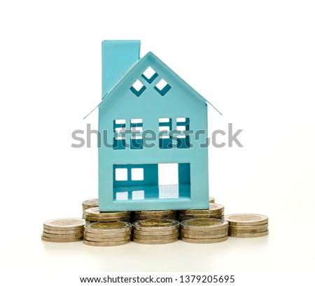 coins stacks and house on white background,business saving and investment concept
