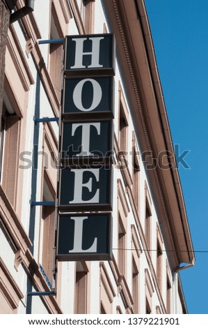 closeup of hotel signage on building facade