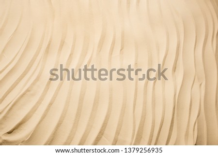 top view of background with textured sand and copy space