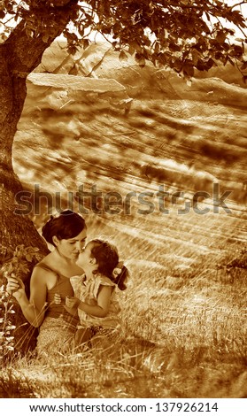 retro sepia photo, mother, daughter, woman and child sitting grass near tree photo tenderness and family