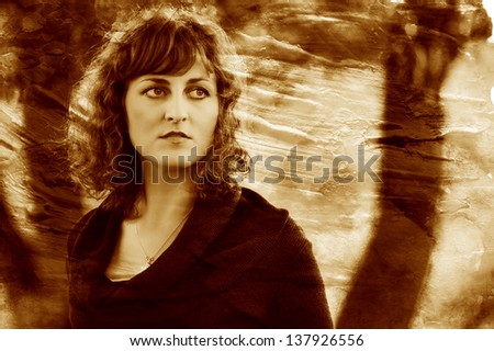 retro sepia photo curly-haired young European girl curled woman in brown dress a large portrait