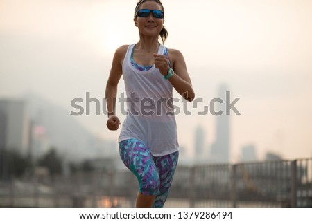 Healthy lifestyle woman runner running on hong kong city