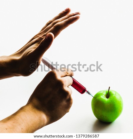 Apple with harmful or healthy medical scientists GMO injection, preserves and pesticides