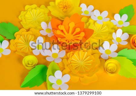 Holiday honey. Yellow background. Handicraft bee painted egg. Easter. Origami paper flower. Lettering. Children's toys paperwork. School and kindergarten child development.